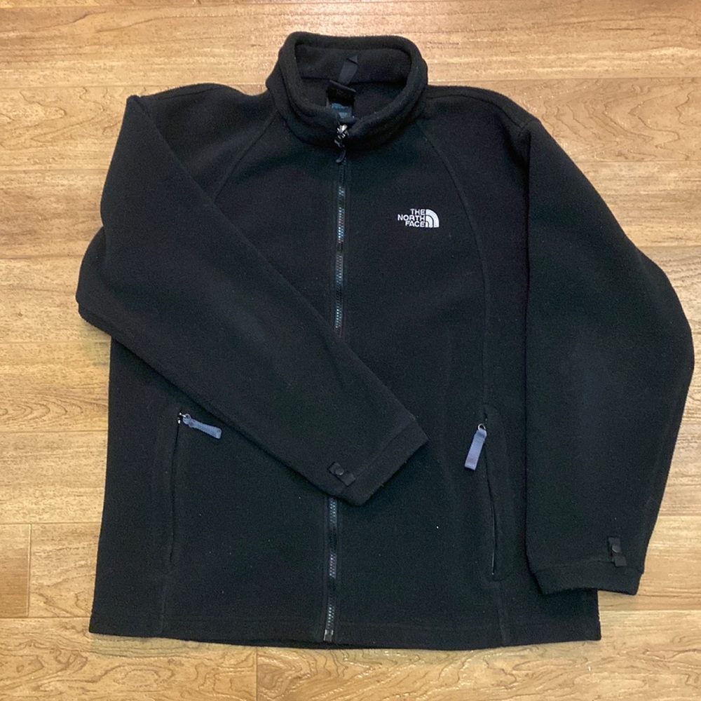 The North Face black fleece. Boys size XL, like medium/large in woman’s.